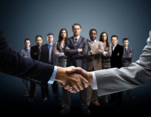 Handshake isolated on business background