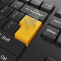 Kauf von Waren über den Online-Shop. Tastatur mit einem Wagen an