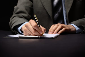 Businessman's Hand mit Stift