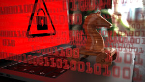 Hölzernes, trojanisches Pferd sitzt auf Laptop, dadrüber befindet sich IT-Sicherheitswarnung